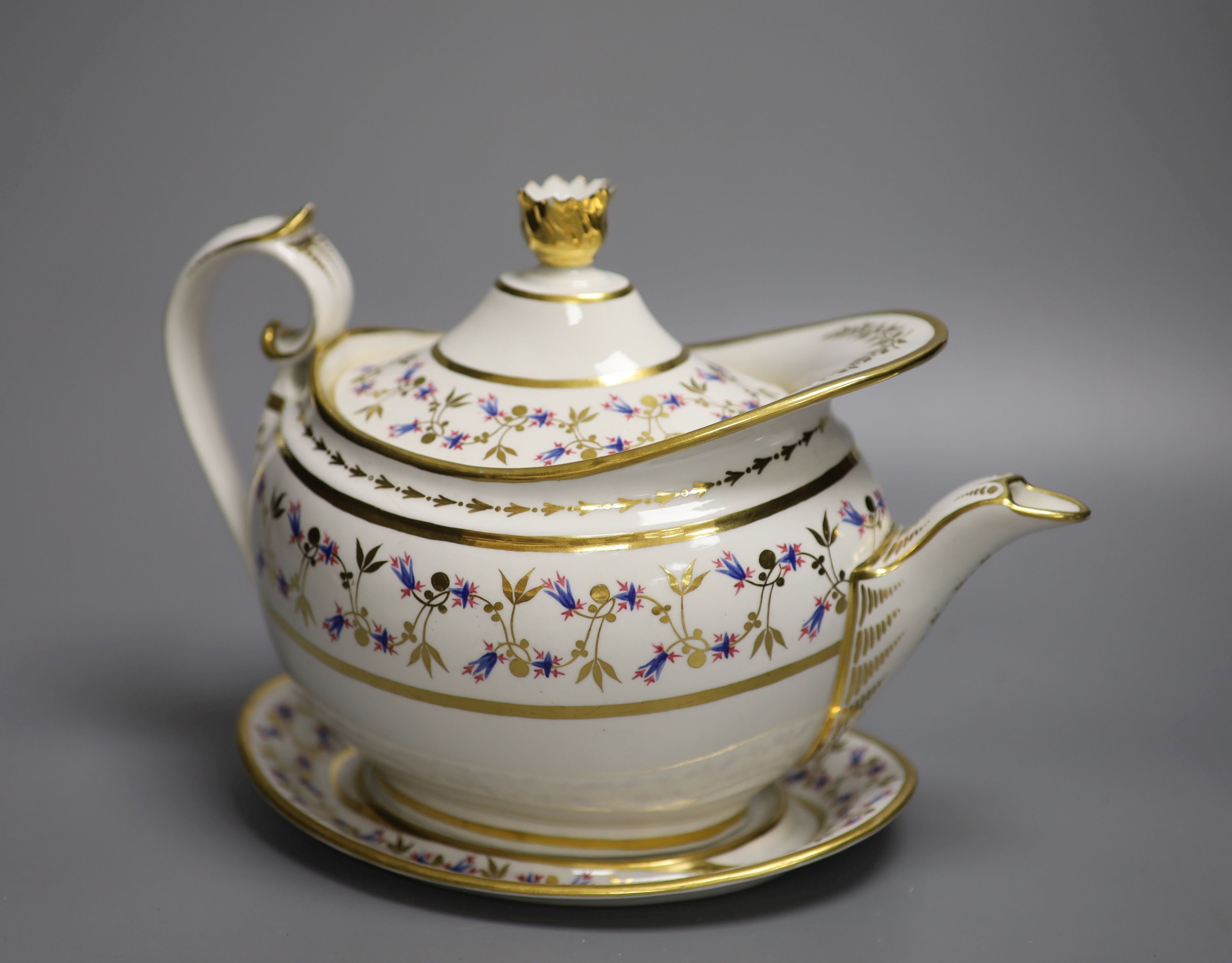 A Flight Barr and Barr teapot cover and stand, painted with cornflowers?, impressed mark to stand crown FBB, c.1825, height 18cm